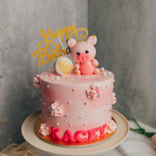 Sprinkle Pink Marble Cake with Pig Topper