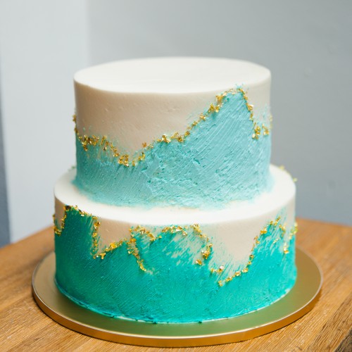 Two Tier Teal and Pastel Blue Painted Swash Cake