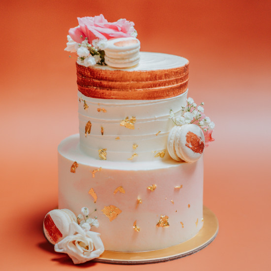 Two Tier Rose Gold & Pink Cake with Florals and Macarons